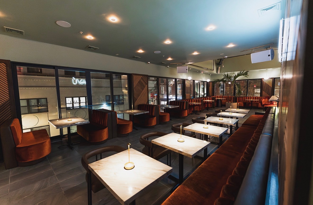 Savu restaurant interior with elegant velvet booths and marble tables